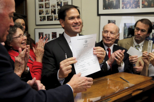 U.S. Republican presidential candidate and U.S. Senator Marco Rubio (R-FL) files his declaration of candidacy to get on the New Hampshire primary ballot with the Secretary of State William Gardner (L) in Concord, New Hampshire November 5, 2015. <br/>Reuters