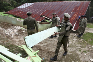 Indonesian civil service police members demolish a church at the Siompin village in Aceh Singkil, Aceh province, October 19, 2015.  <br/>Reuters