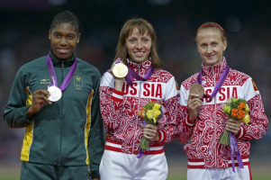 Russia's Mariya Savinova (C) wins gold, South Africa's Caster Semenya (L) won silver and Russia's Ekaterina Poistogova won bronze during the women's 800m victory ceremony at the London 2012 Olympic Games at the Olympic Stadium in this August 11, 2012 file photo.  <br/>Reuters