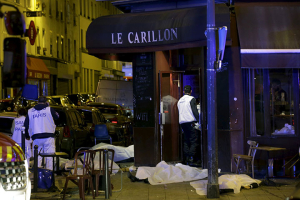 A general view of the scene that shows the covered bodies outside a restaurant following a shooting incident in Paris, France, November 13, 2015. REUTERS/Philippe Wojazer <br/>