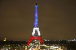 The Eiffel Tower is lit with the blue, white and red colours of the French flag in Paris, France, November 16, 2015, to pay tribute to the victims of a series of deadly attacks on Friday in the French capital. <br/>Reuters