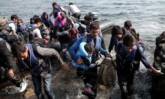 Syrian refugees come ashore on the Greek island of Lesbos in September 2015. <br/>AP photo
