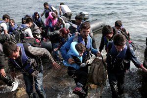Syrian refugees come ashore on the Greek island of Lesbos in September 2015. <br/>AP photo