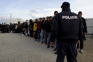 Refugees and migrants line up inside a camp, as they wait to cross Greece's border with Macedonia near the Greek village of Idomeni, November 10, 2015.  <br/>Reuters