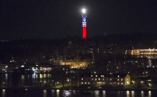 Kaknastornet, the Swedish TV signal tower in Stockholm, is illuminated in the French colors blue, white and red in honor of victims of the attacks in Paris, November 14, 2015.  <br/>Reuters