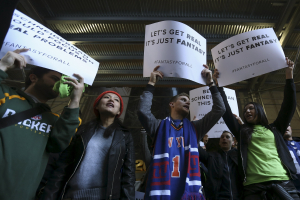 People protest in front of New York Attorney General Eric Schneiderman's office following his decision to shut down fantasy sports sites FanDuel and DraftKings, in the Manhattan borough of New York November 13, 2015.  <br/>Reuters