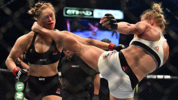 Holly Holm knocked the women's bantamweight champion Ronda Rousey out in the second round with a powerful kick to the head in Melbourne, Australia. <br/>