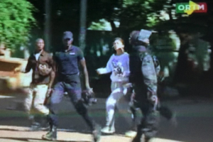 Still image from video show a hostage rushed out from the Radisson hotel in Bamako, Mali, November 20, 2015.  <br/>Reuters
