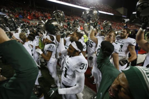 Michigan State players sing their fight song to their fans after their 17-14 win over Ohio State on Saturday. Photo: Julian H. Gonzalez/DFP <br/>