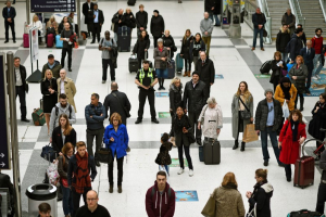 people pause to observe a minute's silence in memory of the victims of the Paris shootings, at Liverpool Street Station in London, Britain November 16, 2015.  <br/>Reuters