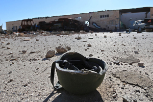A helmet belonging to a Islamic State militant is seen on the ground at the 121 Regiment base after Fighters from the Democratic Forces of Syria took control of the base in the town of al-Melabiyyah, south of Hasaka city, Syria November 24, 2015. REUTERS/Rodi Said <br/>