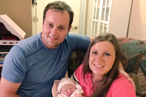 Josh and Anna Duggar pictured with their youngest child, Meredith. <br/>Facebook