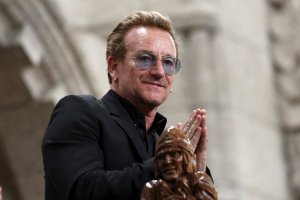 U2 lead singer Bono gestures while being recognized in the House of Commons on Parliament Hill in Ottawa, Canada in this June 15, 2015 file photo.  <br/>REUTERS/Chris Wattie/Files