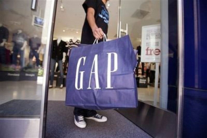 In this Aug. 19, 2009 file photo, a shopper leaves a Gap store in Palo Alto, Calif. Gap Inc. releases quarterly earnings at the close of the market Thursday, Nov. 19, 2009. <br/>AP Images / Paul Sakuma, File