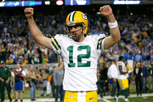 Aaron Rodgers (12) raises his arms in victory during the fourth quarter against the Detroit Lions at Ford Field. Packers win 27-23. Mandatory Credit: Raj Mehta-USA TODAY Sports <br/>