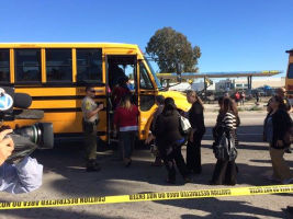 School buses being loaded, escorted by sheriff's deputies on Waterman. <br/>Facebook/San Bernardino Shooting