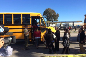 School buses being loaded, escorted by sheriff's deputies on Waterman. <br/>Facebook/San Bernardino Shooting