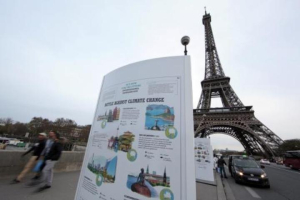 An information board about climate change is seen on a bridge near the Eiffel Tower ahead of the World Climate Conference 2015. <br/>Reuters