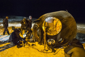 A search and rescue team works on the site of landing of the Soyuz TMA-17M capsule carrying the International Space Station (ISS) crew of Kjell Lindgren of the U.S., Oleg Kononenko of Russia and Kimiya Yui of Japan near the town of Dzhezkazgan (Zhezkazgan), Kazakhstan, December 11, 2015. REUTERS/GCTC/Andrey Shelepin/Pool <br/>
