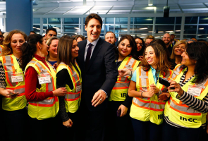 Canada's Prime Minister Justin Trudeau meets airport staff as they wait for Syrian refugees to arrive at the Toronto Pearson International Airport in Mississauga, Ontario, December 10, 2015. REUTERS/Mark Blinch <br/>