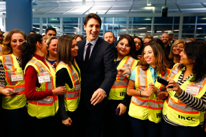 Canada's Prime Minister Justin Trudeau meets airport staff as they wait for Syrian refugees to arrive at the Toronto Pearson International Airport in Mississauga, Ontario, December 10, 2015. REUTERS/Mark Blinch <br/>