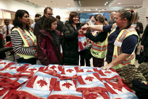 Syrian refugees receive welcome bags at the Toronto Pearson International Airport in Mississauga, Ontario, Canada December 11, 2015. REUTERS/Mark Blinch <br/>
