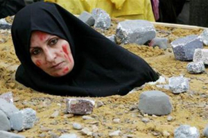 A woman was sentenced to death by stoning in Iran on International Human Rights Day Dec. 10, 2015. For this photo, an Iranian woman symbolically dressed up as a victim of death by stoning as part of a protest by the National Council of Resistance of Iran in Brussels.  <br/>Reuters 