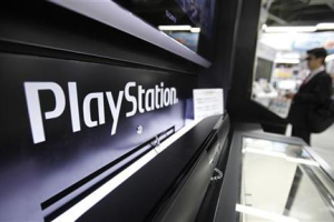 A man plays a game on Sony Corp's PlayStation 3 game console at an electronic store in Tokyo April 27, 2011. <br/>Reuters/Yuriko Nakao