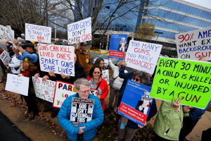 Activists hold a protest and vigil against gun violence on the third anniversary of the Sandy Hook mass shooting, outside the National Rifle Association (NRA) headquarters in Fairfax, Virginia December 14, 2015.  <br/>Reuters