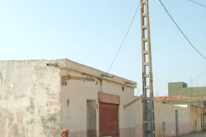 An Algerian man sits on a doorstep. <br/>Open Doors USA