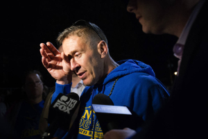 Bremerton High assistant football coach Joe Kennedy wipes his eyes as he talks to the media after a football game in Bremerton, Wash.<br />
 <br/>AP photo