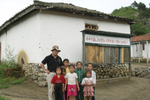 <br />
Canadian pastor Rev. Hyeon Soo Lim is shown with North Korean children during one of his humanitarian assistance visits in 2007 in this image released by Light Korean Presbyterian Church on December 17, 2015.  <br/>REUTERS/Light Korean Presbyterian Church/Handout