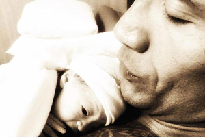 'The Rock' snuggles baby Jasmine skin to skin. Instagram <br/>