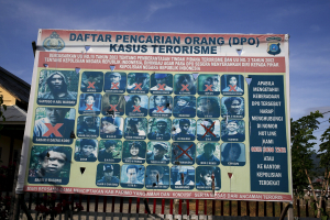 A police billboard showing a list of individuals, including the country's top militant Santoso (top L), wanted in relation with terrorism cases in Poso, Indonesia's Central Sulawesi province, December 19, 2015.  <br/>Reuters
