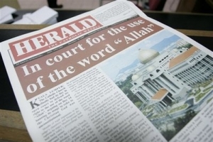 This photo taken Wednesday, Dec. 30, 2009, shows a copy of the Herald newspaper highlighting the impending verdict of the publication's religious discrimination lawsuit, in Kuala Lumpur, Malaysia, Wednesday, Dec. 30, 2009. A Malaysian court ruled Thursday, Dec. 31, 2009, that Christians have the constitutional right to use the word Allah while referring to God, striking down an old government ban as illegal. <br/>AP Photo / Lai Seng Sin