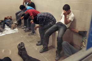 Immigrants who have been caught crossing the border illegally are housed inside the McAllen Border Patrol Station in McAllen, Texas, in this file photo taken July 15, 2014. <br/> REUTERS/ Rick Loomis/Pool/Files