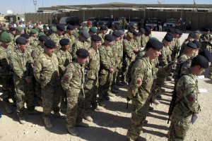 British soldiers, part of NATO's International Security Assistance Force (ISAF), observe a moment of silence during Britain's Veterans Day ceremony at a NATO base in Helmand province, in this November 11, 2012 file photo.  <br/>Reuters