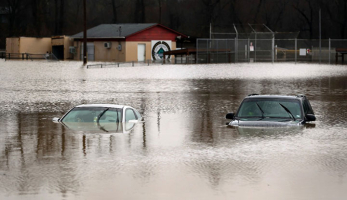Cars are submerged in flood waters in Kimmswick, Missouri, on December 28, 2015.  <br/>