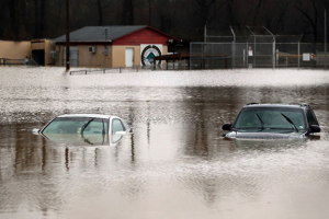 Cars are submerged in flood waters in Kimmswick, Missouri, on December 28, 2015.  <br/>