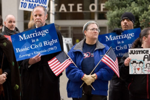 Protesters stand outside a federal court in San Francisco, Calif., Monday morning as the Proposition 8 trial begins. For the next two to three weeks, Chief U.S. District Judge Vaughn R. Walker will hear from lawyers arguing for and against Proposition 8, the constitutional amendment passed by California voters in November 2008 that defined marriage between a man and woman. <br/>The Gospel Herald/Hudson Tsuei