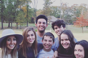 Duck Dynasty's Korie and Willie Roberston announce they are in the process of adopting a teenage boy (shown in front middle of this photo). Prior children of this family include John Luke, Sadie, and Bella, adopted son Will, and their foster daughter, Rebecca. <br/>Korie Robertson Facebook 