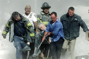 Glenview Elementary School was starting the day by reciting the Pledge of Allegiance, followed by the words, ''God bless America'' at the end as a way to honor all of the first responders at the 9/11 attack site. Rescue workers carry mortally injured New York City Fire Department chaplain, the Rev. Mychal Judge, from the wreckage of the World Trade Center in New York City in this file photo from early September 11, 2001. REUTERS/Shannon Stapleton <br/>