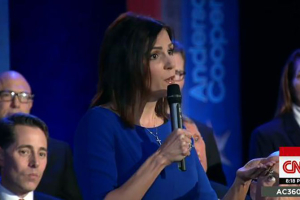 Taya Kyle, wife of Chris Kyle, speaks to Obama during a CNN-hosted town hall meeting. YouTube/ScreenGrab <br/>