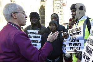 The Archbishop of Canterbury Justin Welby (L) speaks with protestors in the grounds of Canterbury Cathedral in Canterbury, southern Britain January 15, 2016. <br/> REUTERS/Toby Melville
