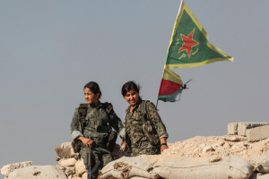 Kurdish People's Protection Units, or YPG women fighters stand near a check point in the outskirts of the destroyed Syrian town of Kobane, also known as Ain al-Arab, Syria. June 20, 2015.  <br/>Getty Images