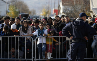 Migrants wait to register with the police at the refugee center in Presevo, Serbia. (AP Photo / Darko Vojinovic) <br/>