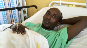 Salah Farah, seen here after Al-Shabaab militants shot him during a bus attack in Kenya, died Monday during surgery. <br/>VOA News