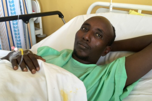 Salah Farah, seen here after Al-Shabaab militants shot him during a bus attack in Kenya, died Monday during surgery. <br/>VOA News