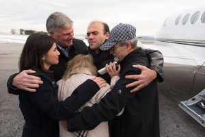 Pastor Saeed is embraced by his parents, sister, and the Rev. Franklin Graham after arriving in North Carolina on Thursday. <br/>Facebook
