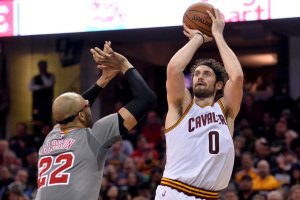 Jan 23, 2016; Cleveland, OH, USA; Cleveland Cavaliers forward Kevin Love (0) shoots the ball over Chicago Bulls forward Taj Gibson (22) during the second quarter at Quicken Loans Arena. The Bulls won 96-83.  <br/>Ken Blaze-USA TODAY Sports
